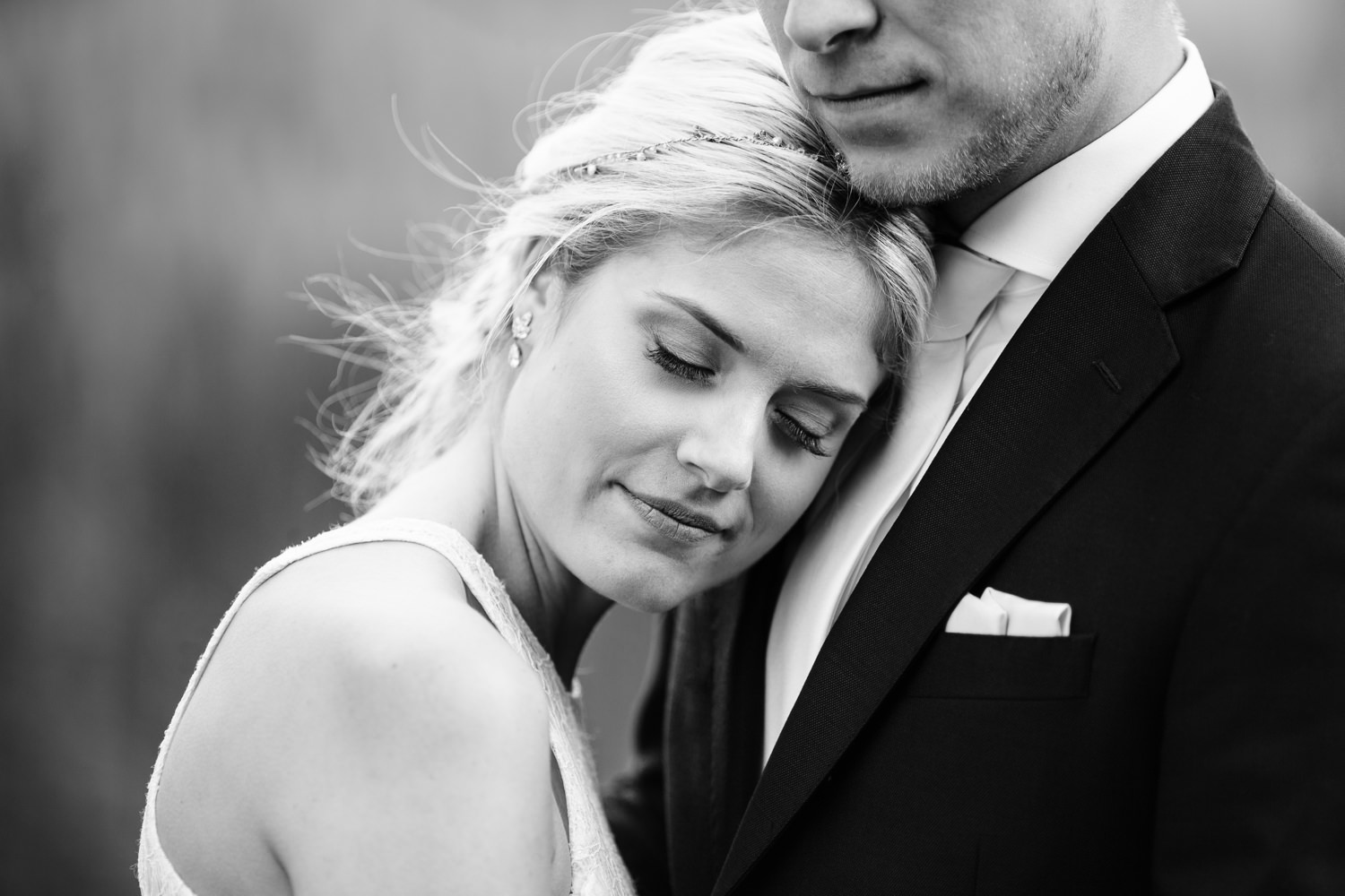 bride and groom embracing by seattle wedding photographer cameron zegers
