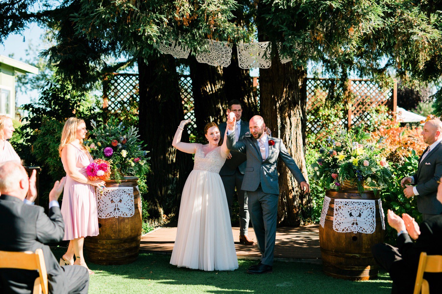 bride and groom recessional at wedding at Sova Gardens