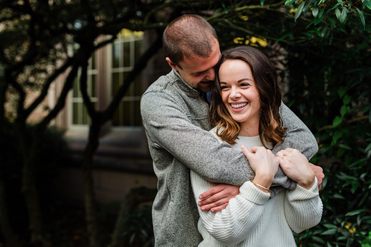 a happy couple at their engagement session at University of Washington in Seattle