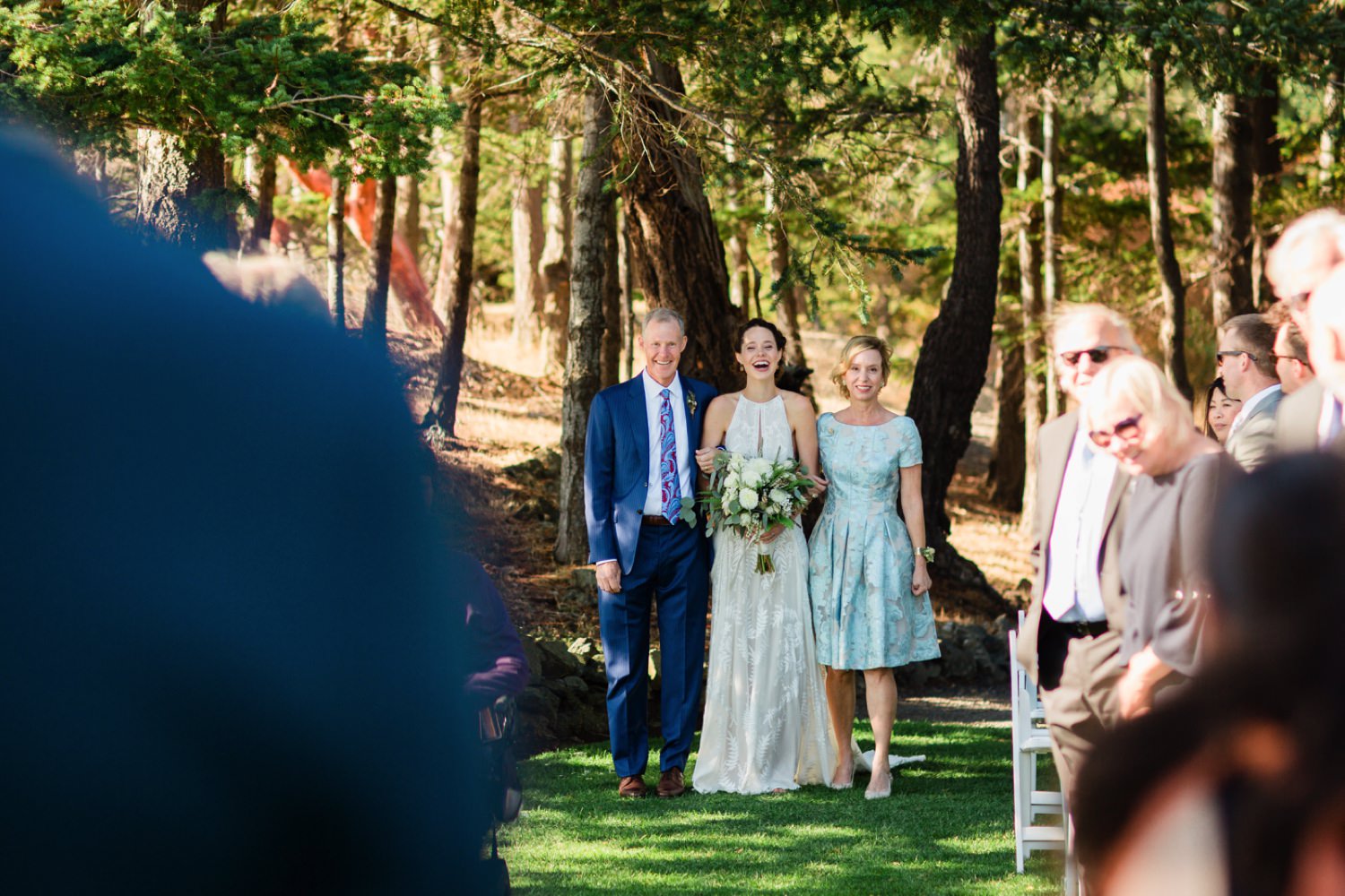 bride and parents walking down the aisle at wedding in San Juan Islands