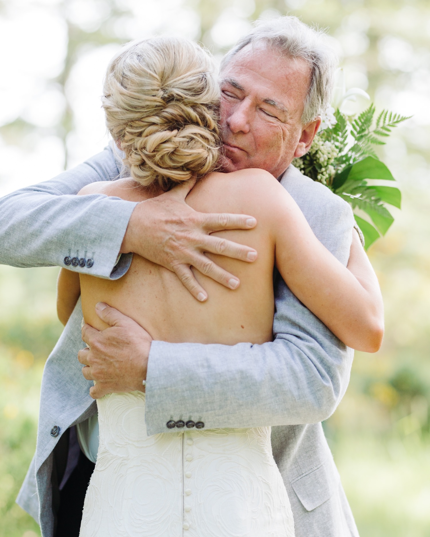 father hugging bride at Saltwater Farm
