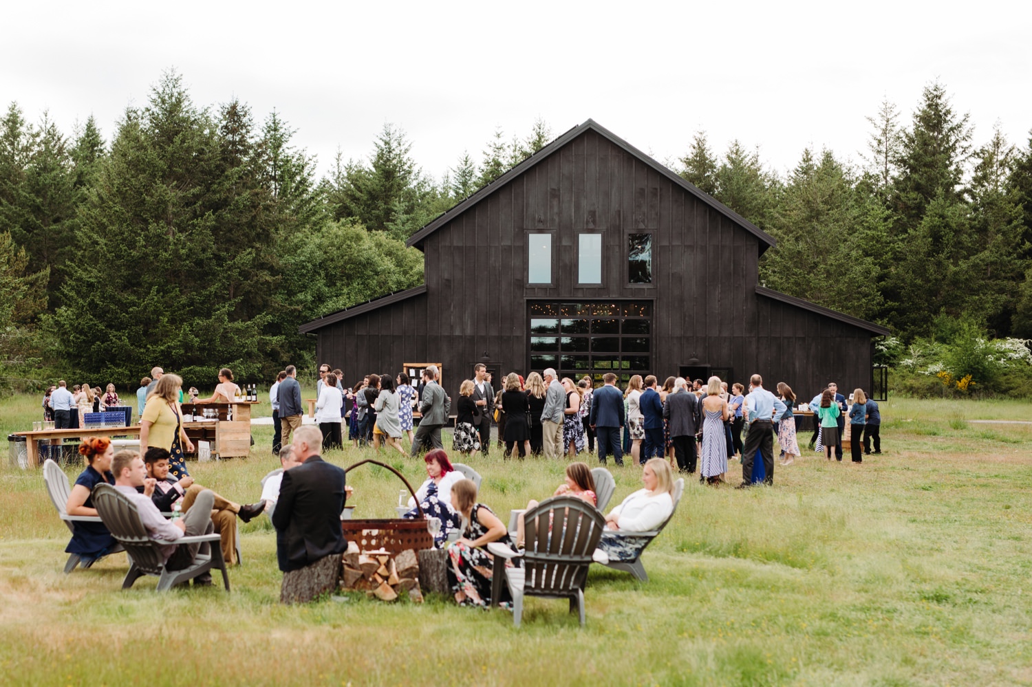cocktail hour and barn at Saltwater Farm wedding venue