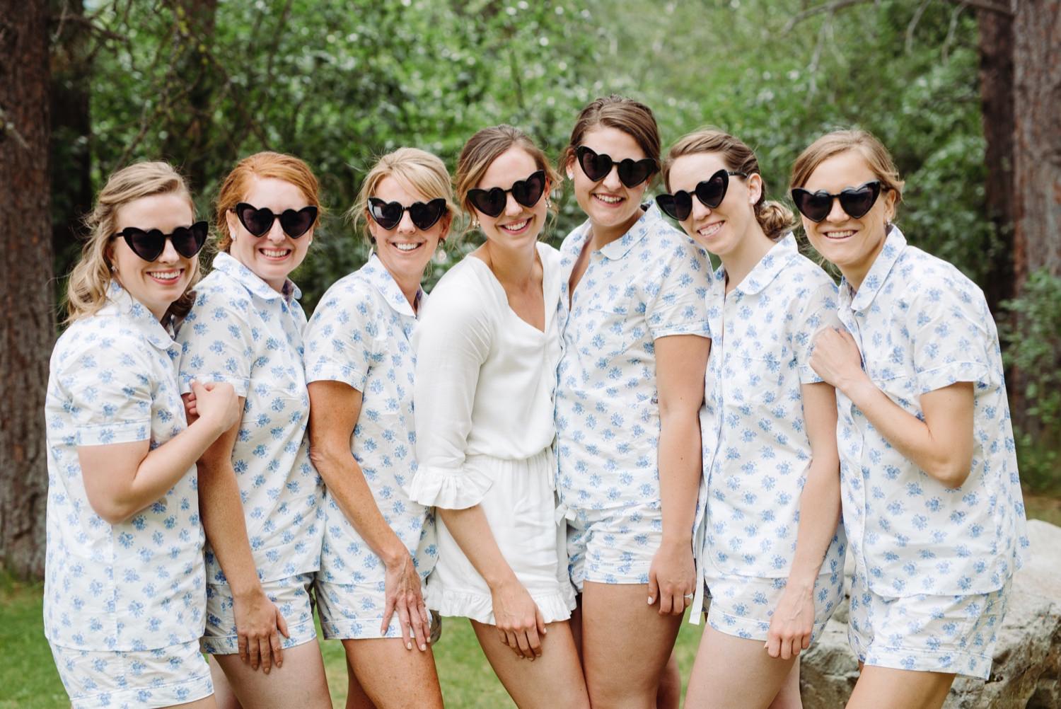 bridesmaids wearing fun heart-shaped sunglasses