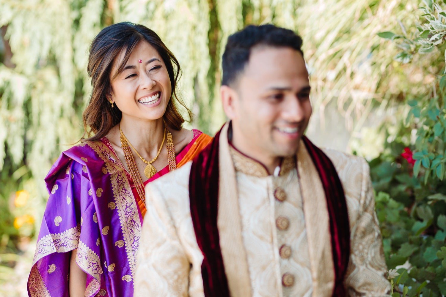 couple at their first look in Indian wedding attire