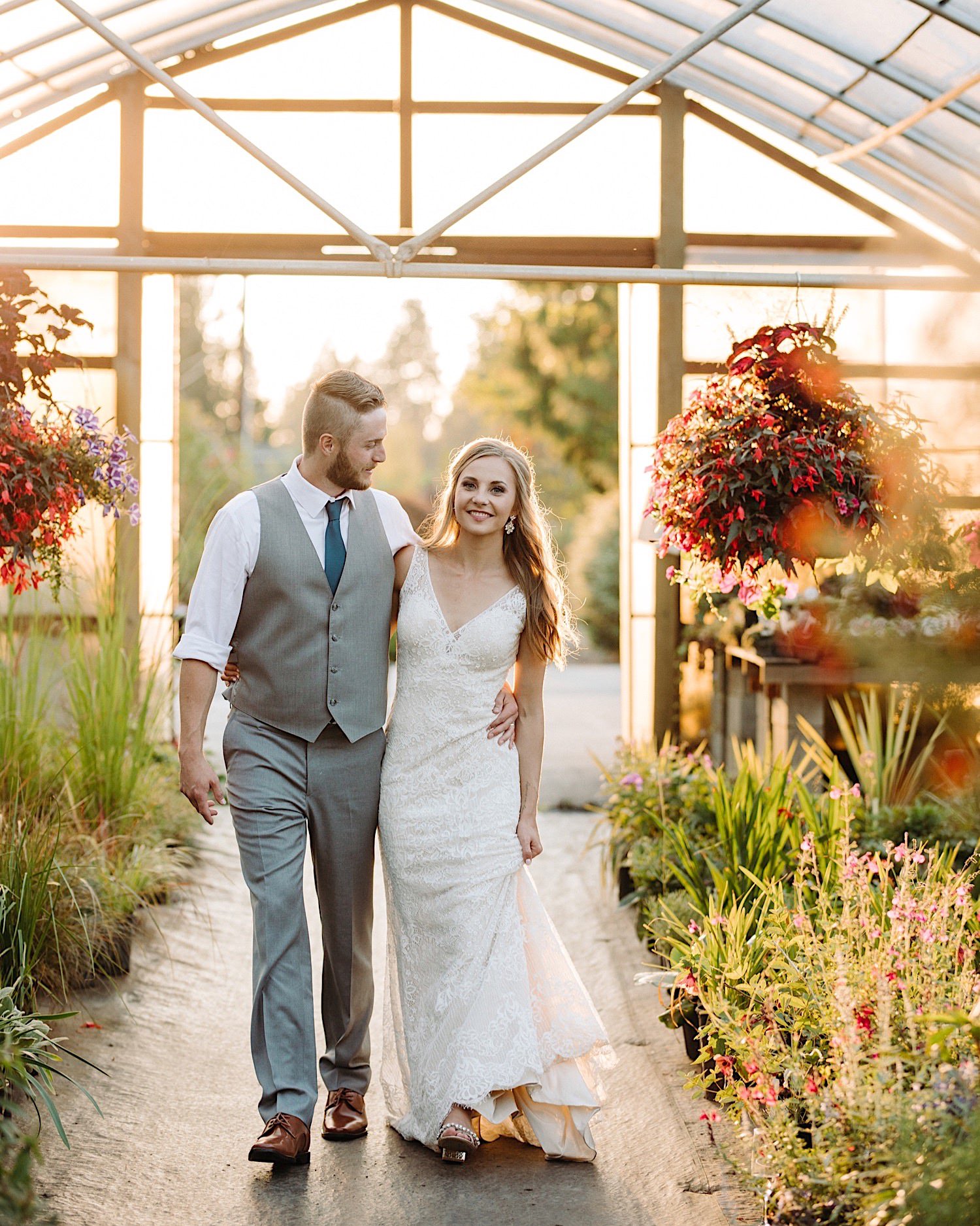wedding couple at sunset in greenhouse at Pine Creek Farms and Nursery