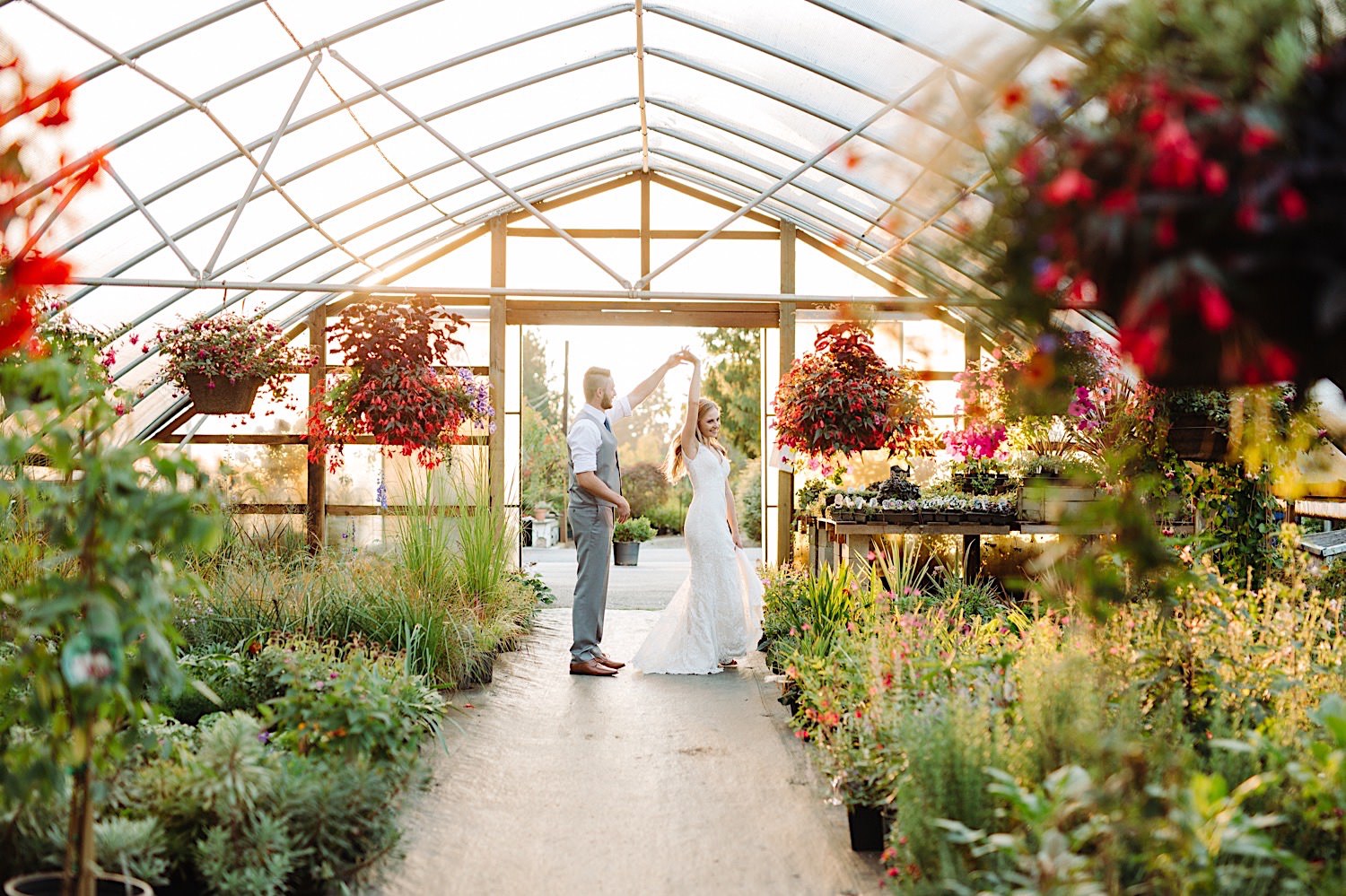 wedding couple dancing at sunset in greenhouse at Pine Creek Farms and Nursery