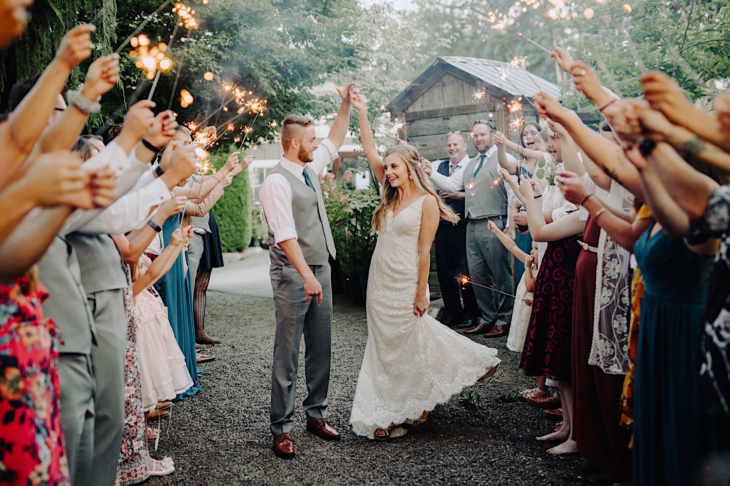 wedding couple dancing through sparklers at Pine Creek Farms and Nursery