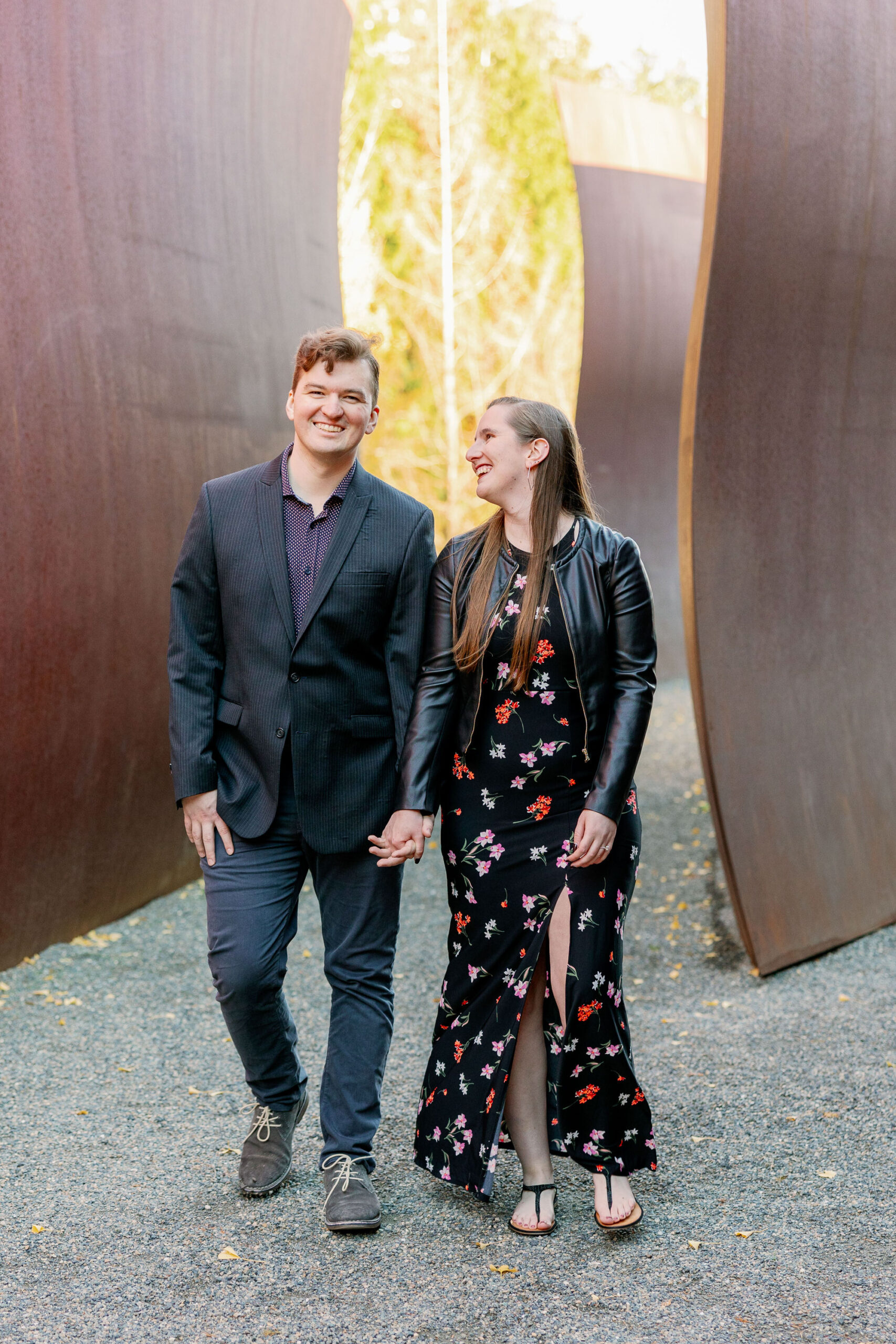 Couple walks together and laughs at Olympic Sculpture Park.