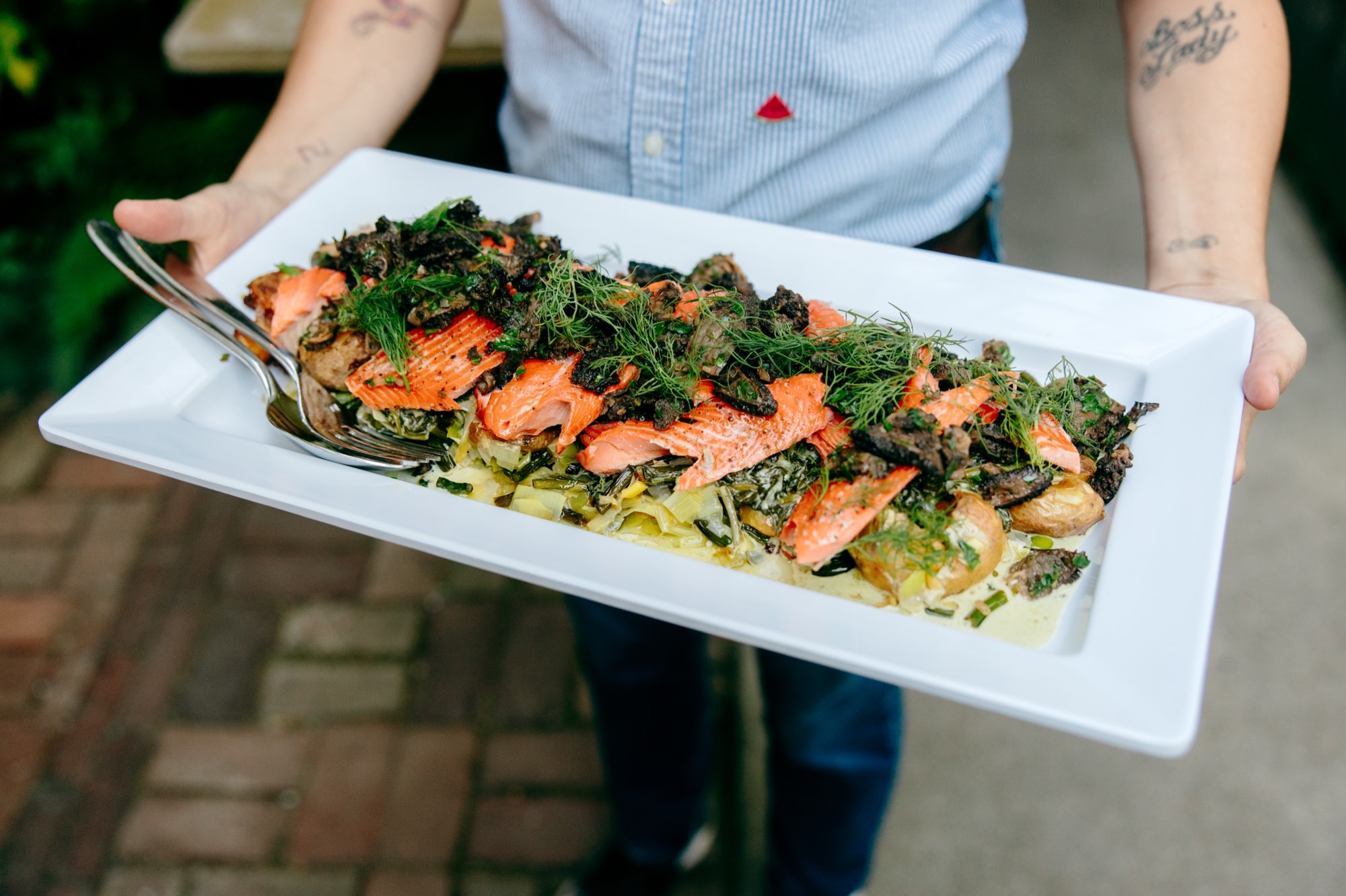 closeup of a platter of food that will be served family-style at the Corson Building.