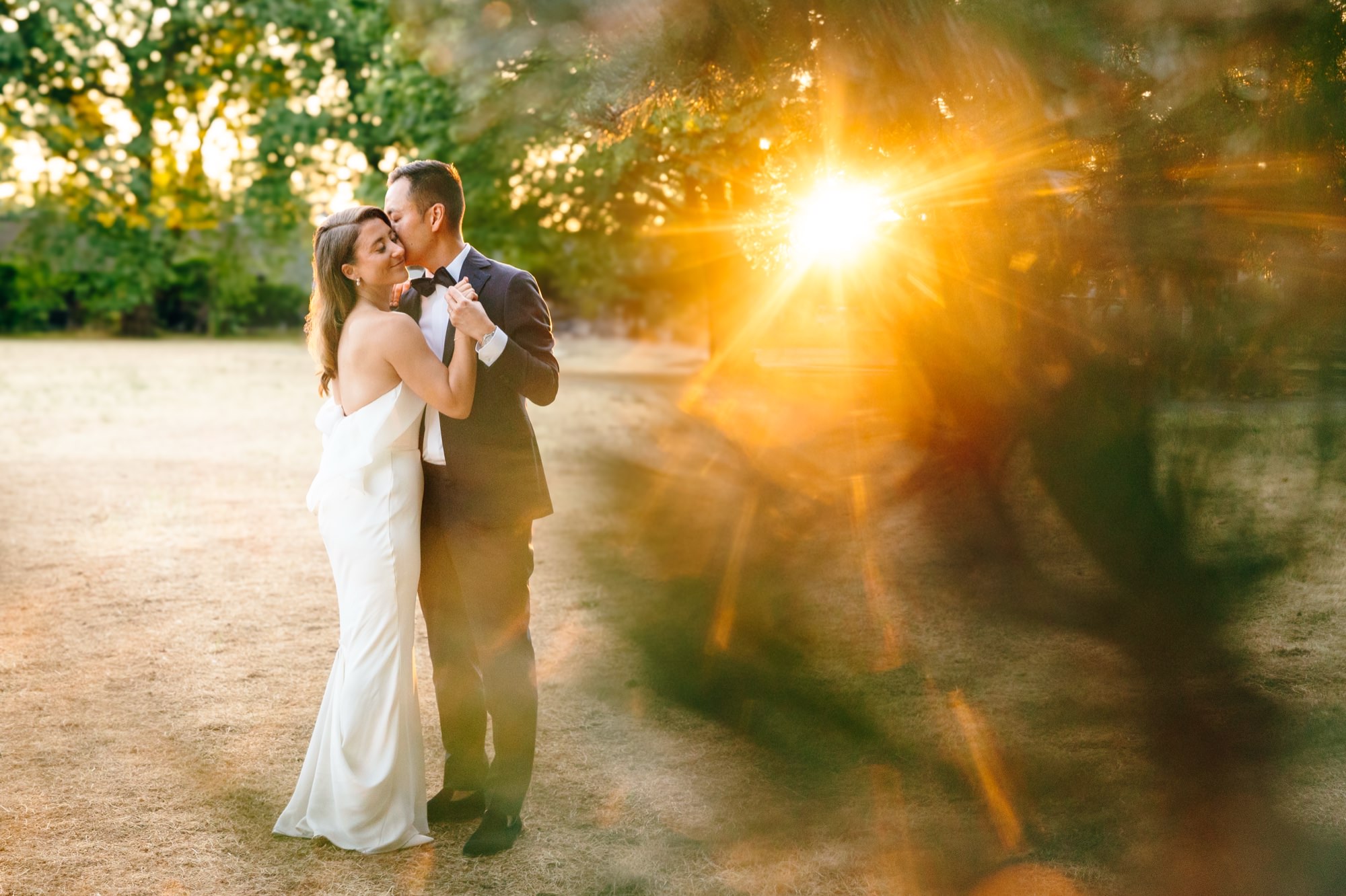 A couple hugs in golden light