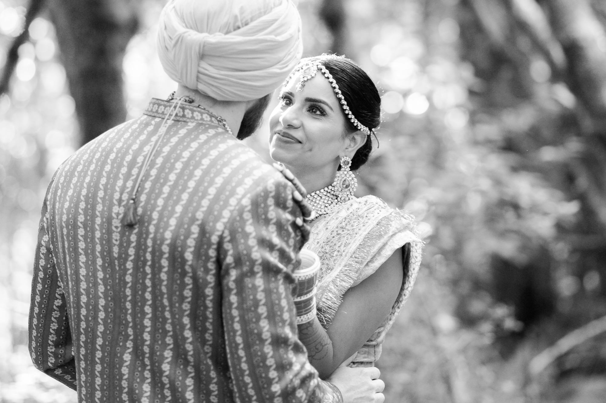 Bride and groom embracing with loving gazes