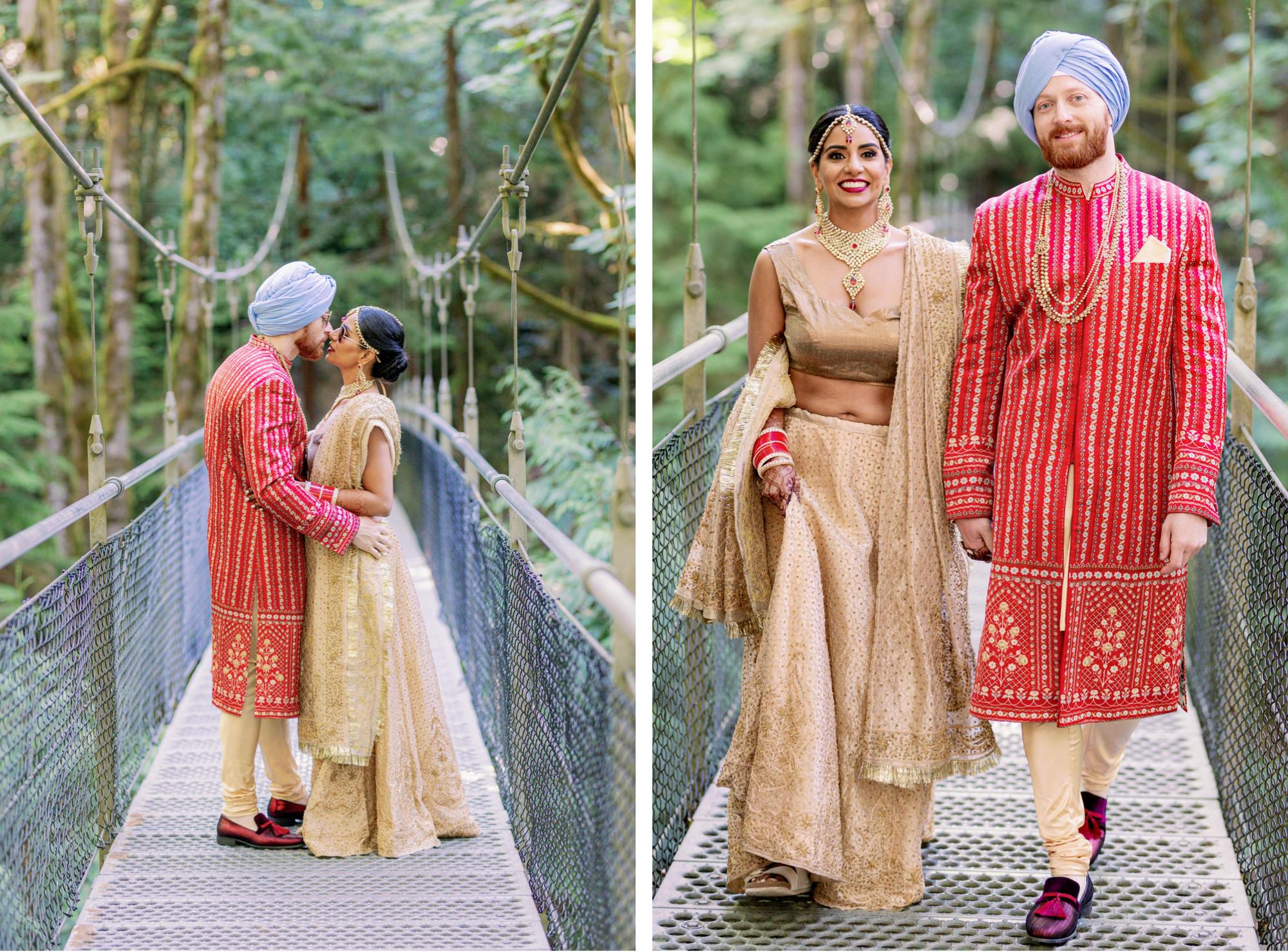 Couple kissing and walking hand-in-hand on a forest bridge during their Indian wedding.