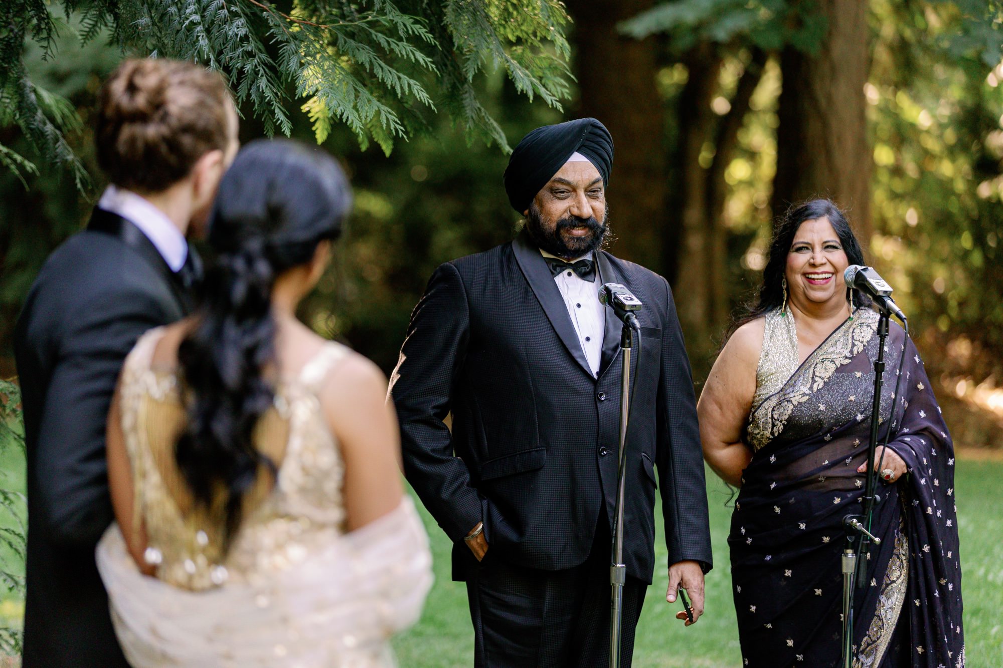 Bride’s parents giving a speech during the wedding ceremony.