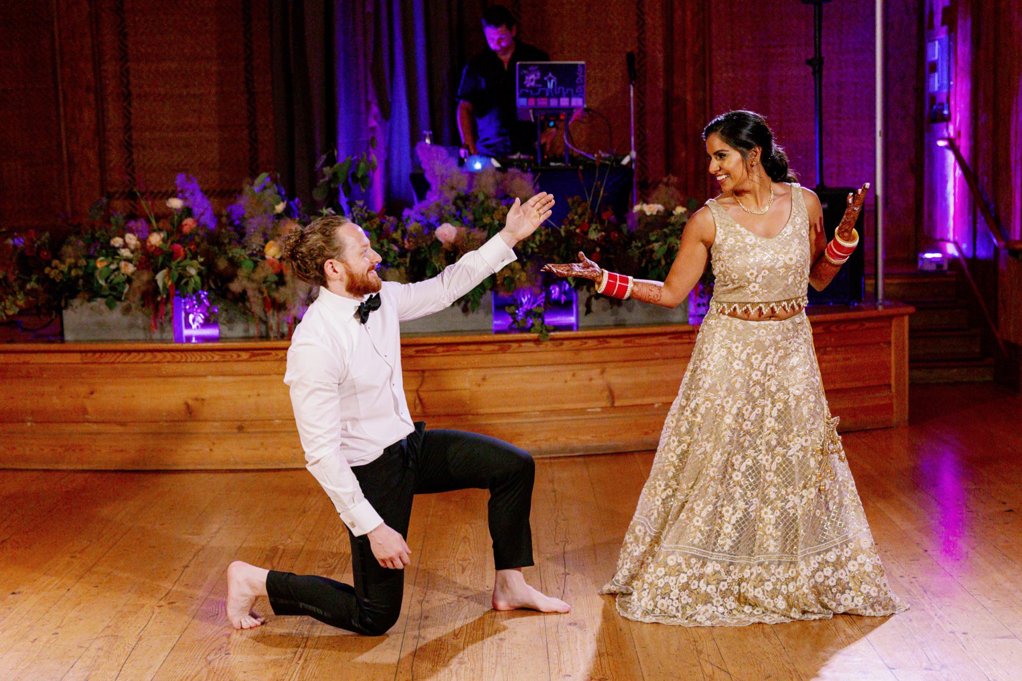 Bride and groom performing a dance routine at IslandWood wedding reception.