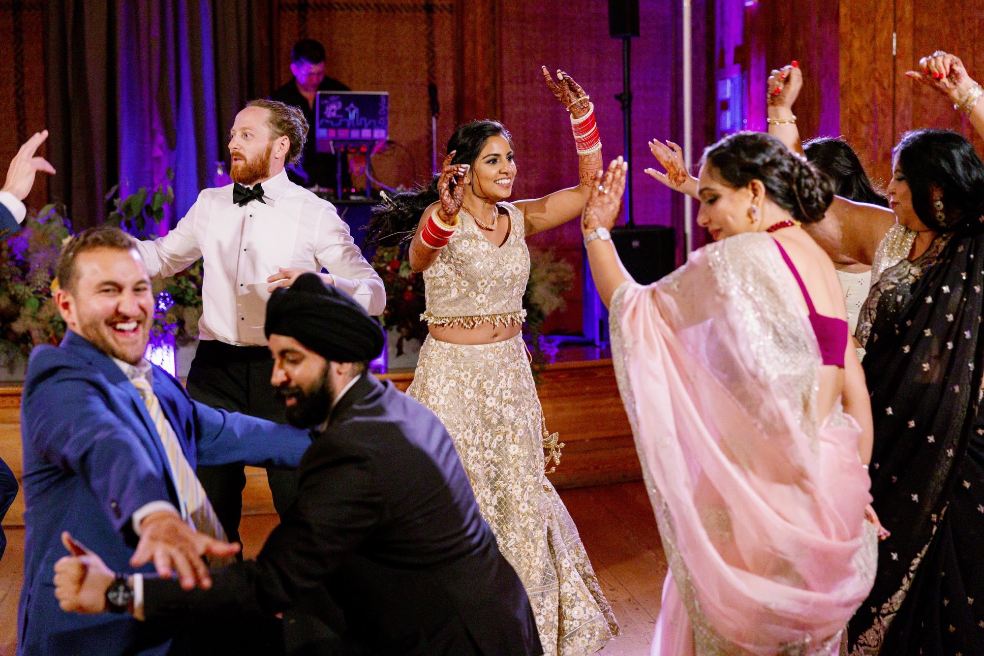 Bride, groom, and guests dancing at IslandWood wedding reception.