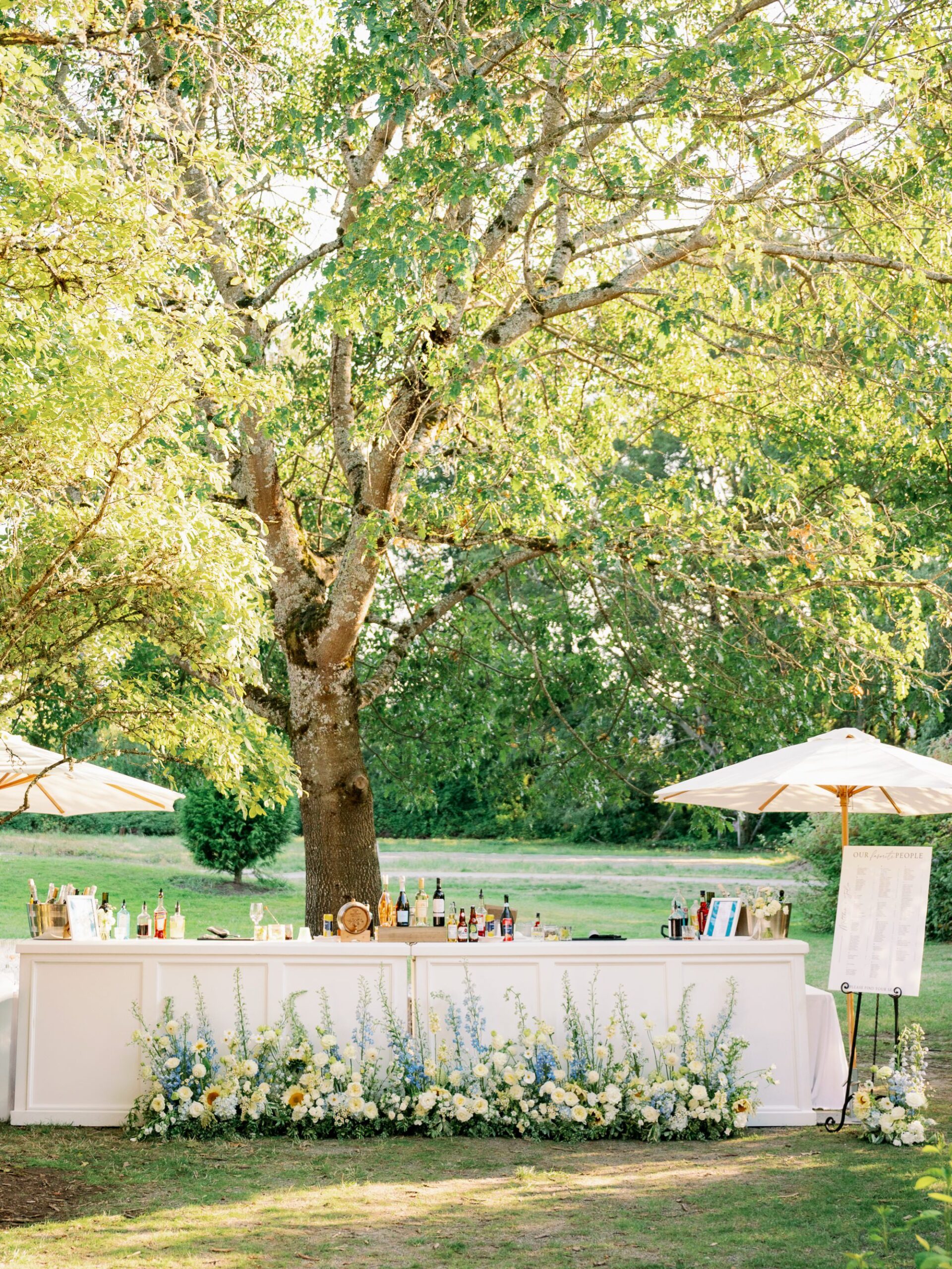An elegant bar is set up on the lawn ready for wedding guests to celebrate.