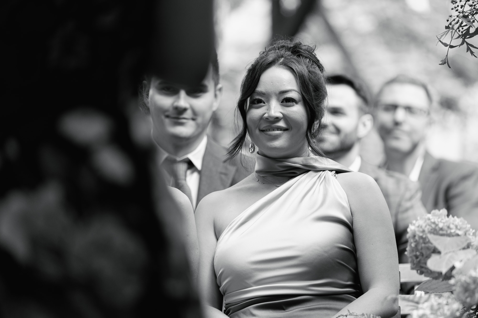A wedding guest looks on during the ceremony
