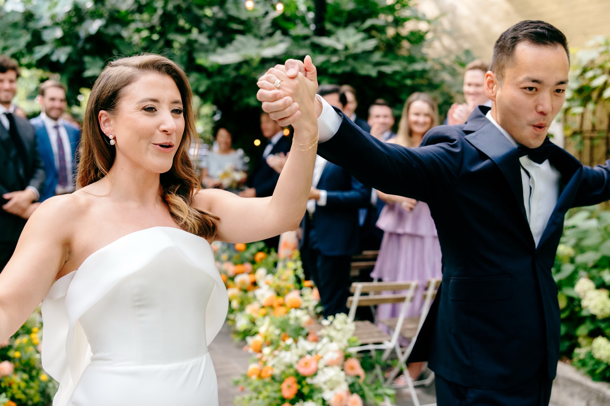 a happy couple at the end of their wedding ceremony