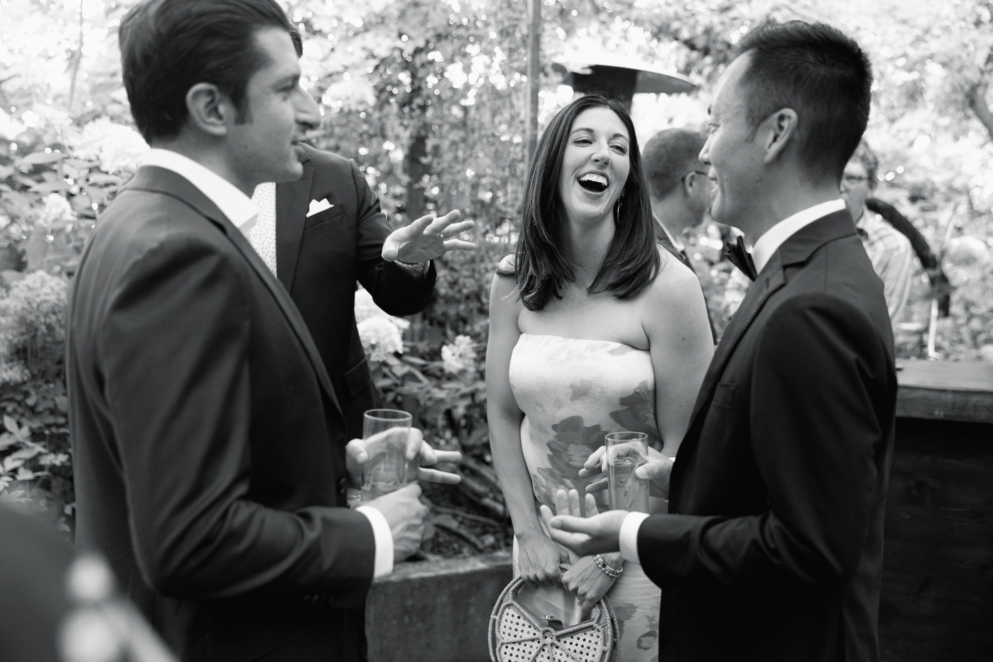 Guests laugh and celebrate at cocktail hour