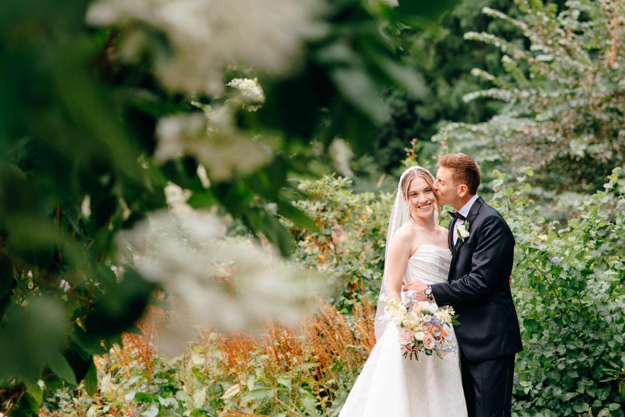 Wedding portrait of the couple at Fox Hollow Farm, surrounded by lush greenery and natural beauty for a Seattle wedding.