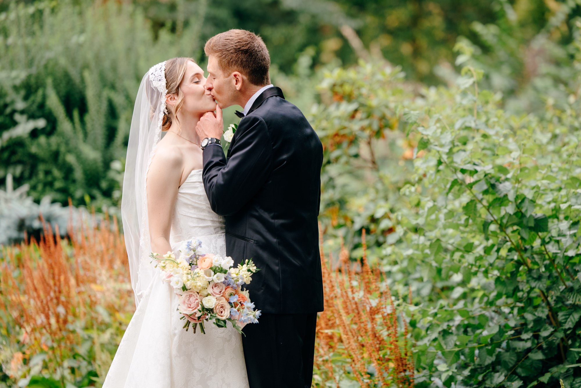 Bride and groom enjoying portraits at Fox Hollow Farm during their Seattle outdoor wedding celebration.