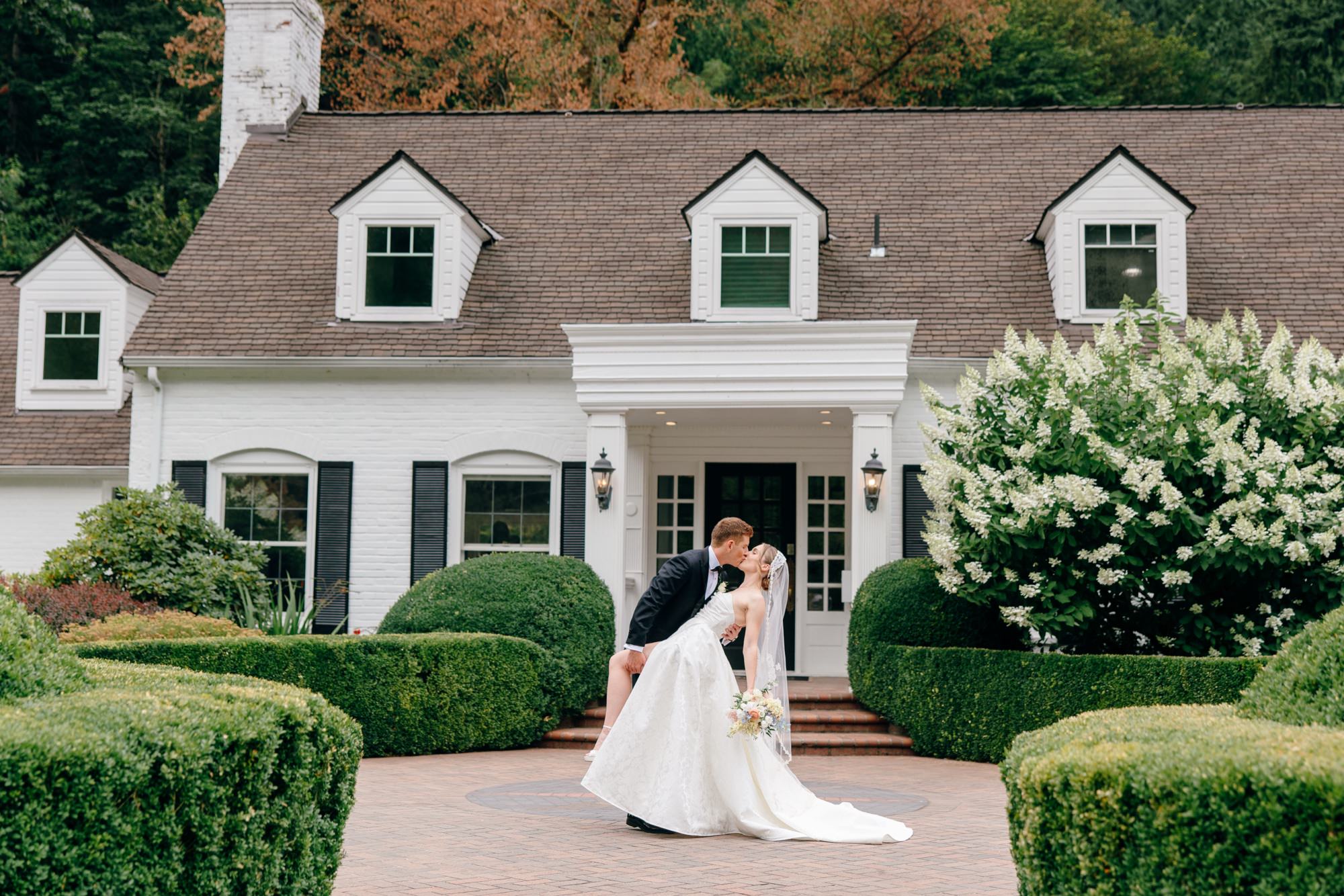 Romantic portrait of the bride and groom outside the historic manor at Fox Hollow Farm in Seattle.