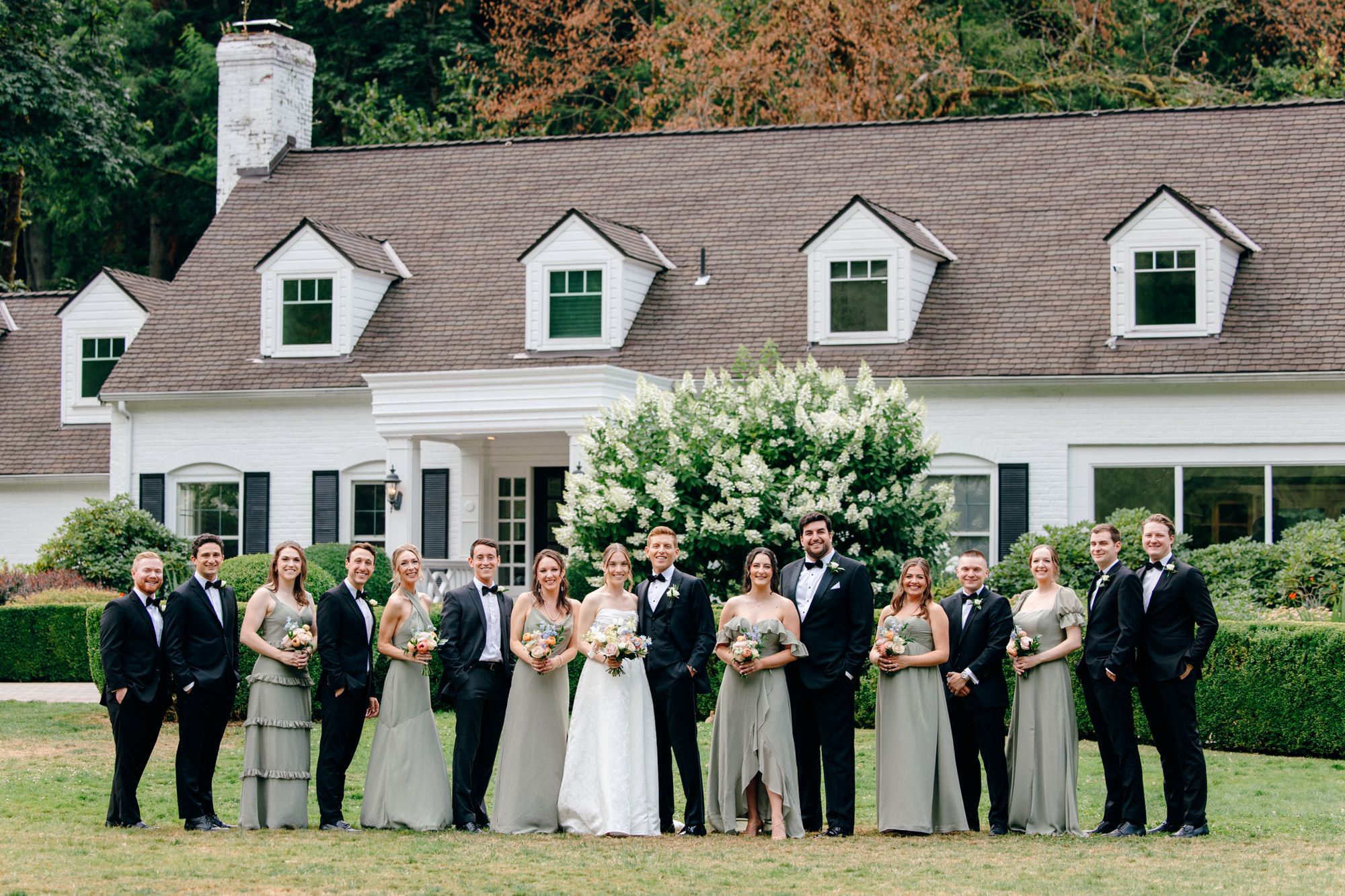 Wedding party posing together at Fox Hollow Farm, celebrating a joyful Fox Hollow Farm wedding.