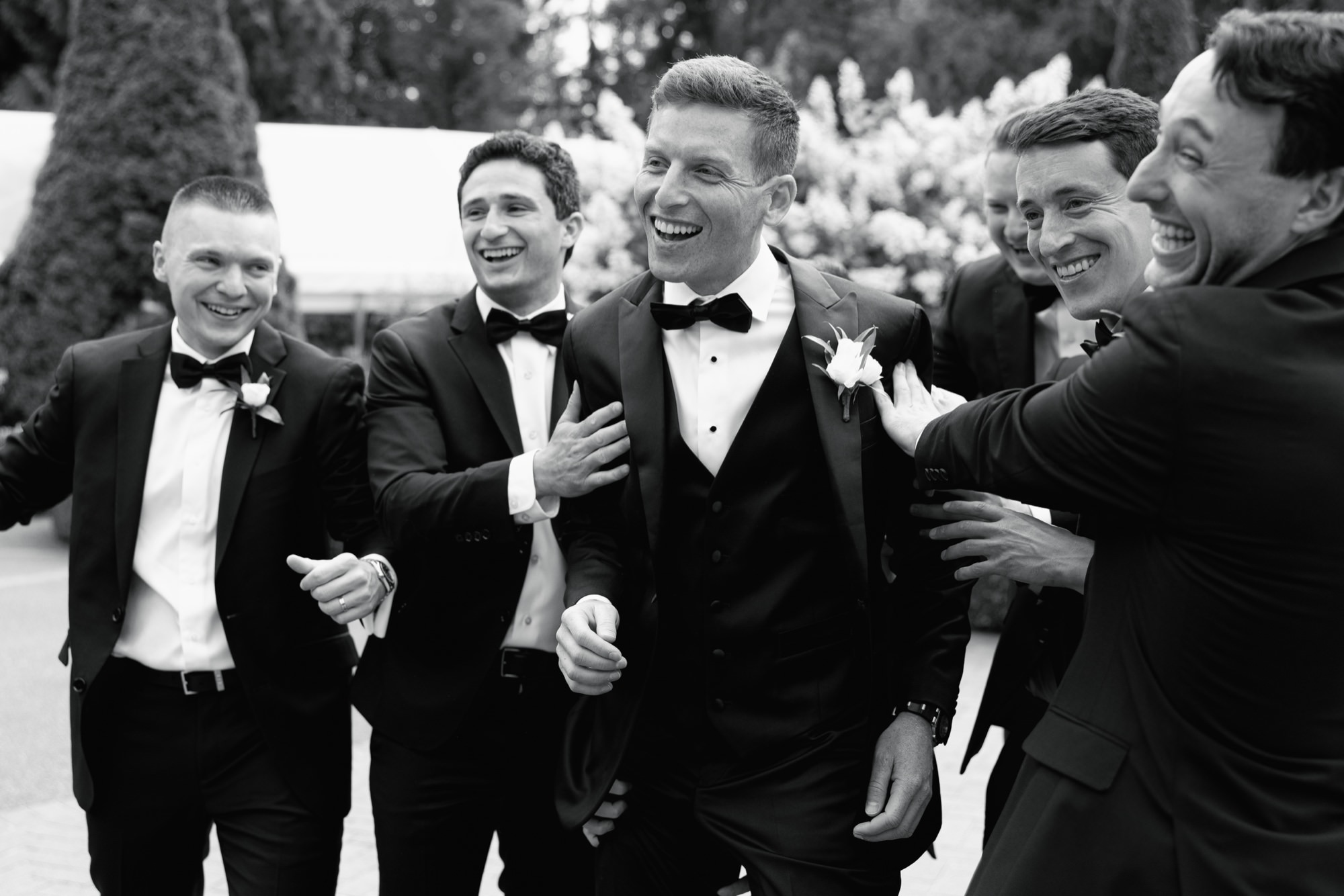 Wedding party captured in fun and candid moments at Fox Hollow Farm.