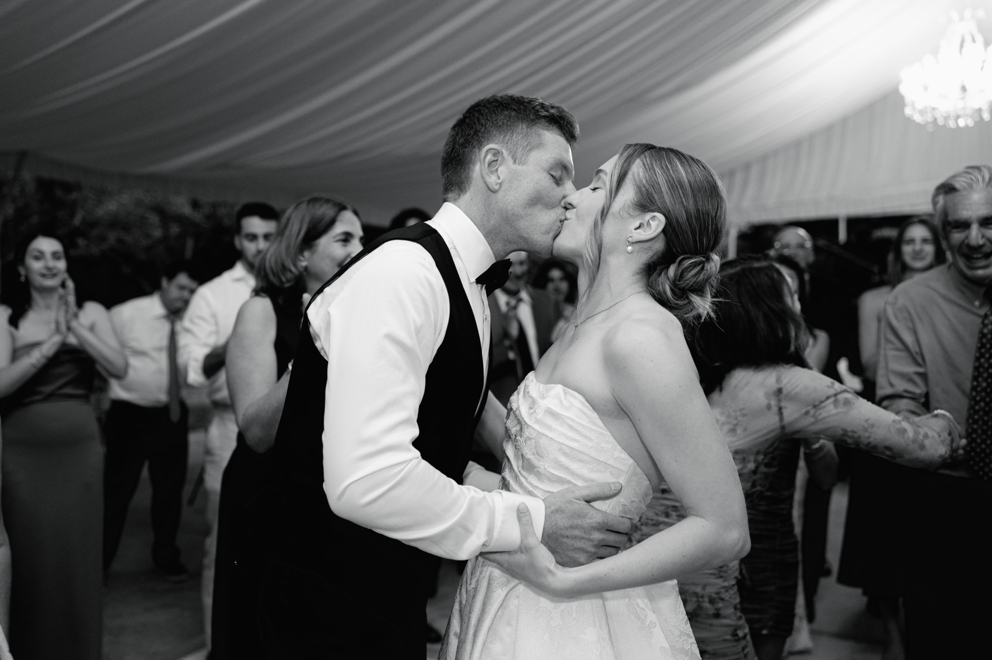 A couple shares a kiss on the dance floor at their wedding at Fox Hollow Farm in Issaquah.