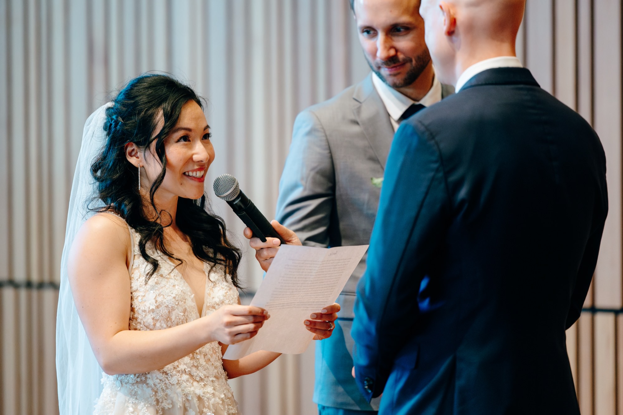 The bride reads her vows during the wedding ceremony.