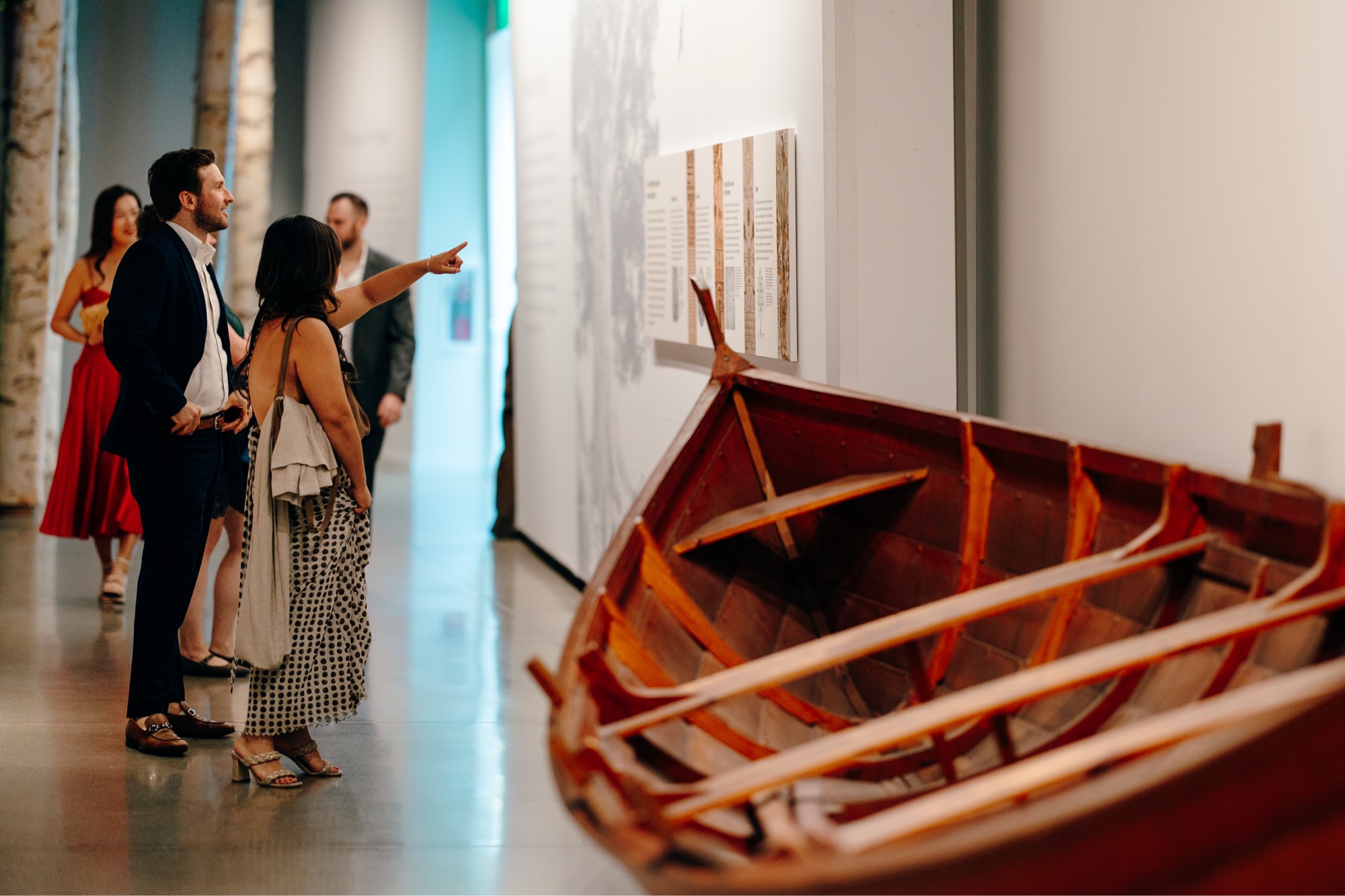 Wedding guests explore the exhibits at National Nordic Museum during cocktail hour.