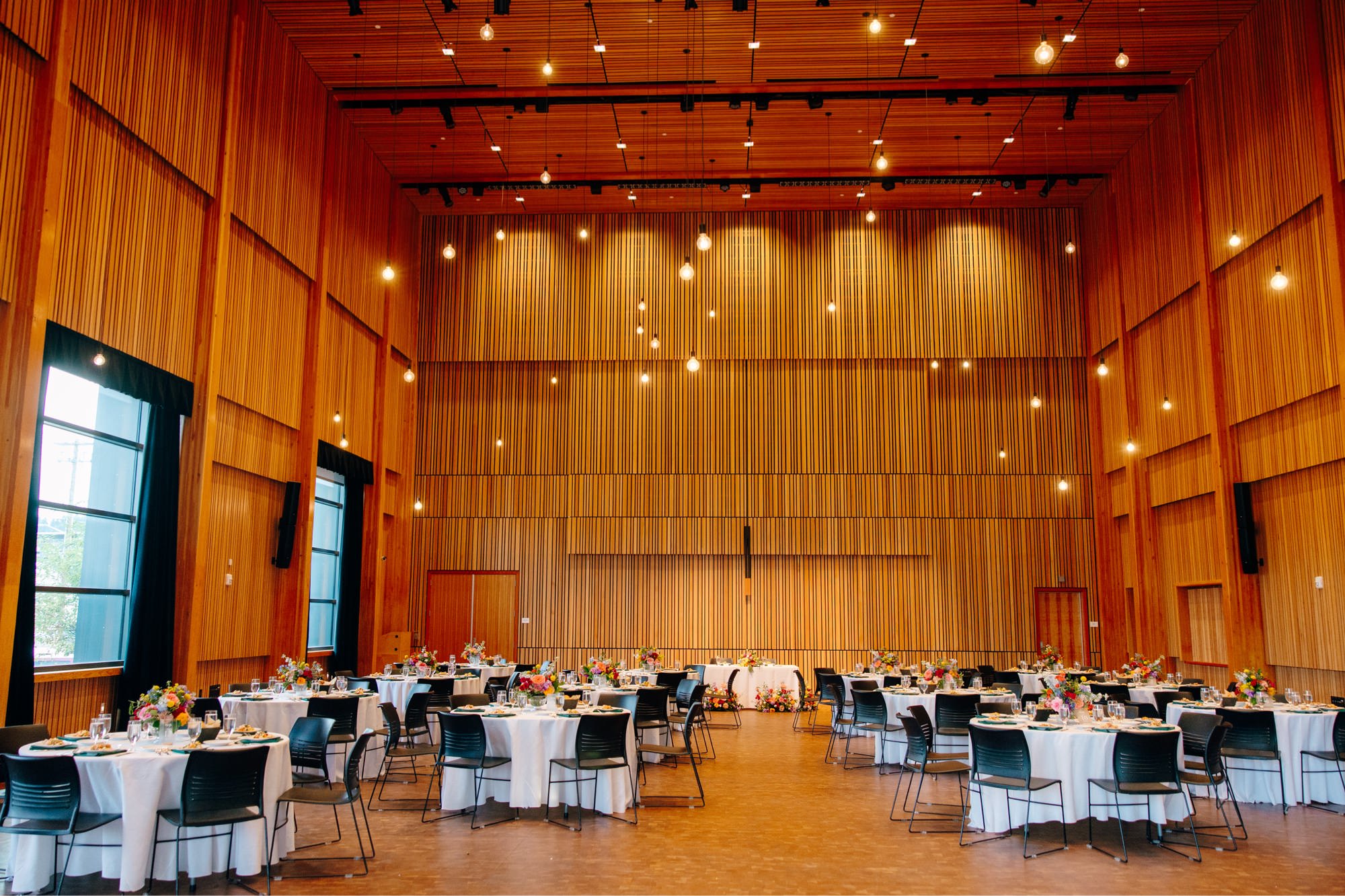 A wide angle view of Osberg Hall set up for a wedding reception at National Nordic Museum.